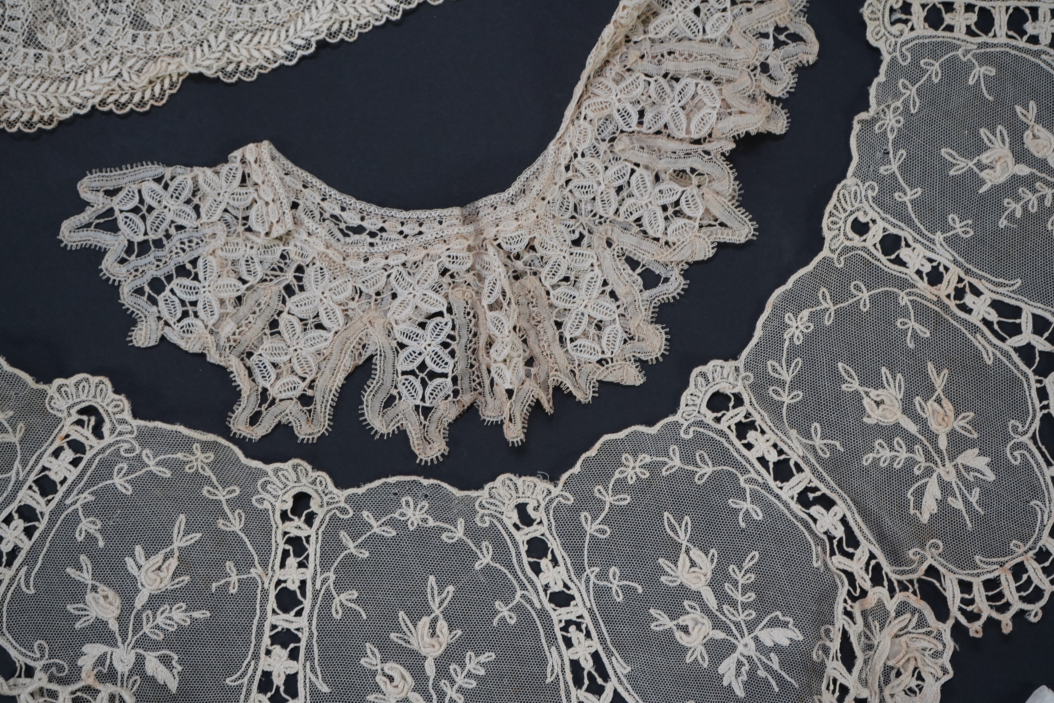 A variety of 19th and 20th century cream lace, being mixed hand and machine collars, lappets, trimmings together with a silk stole. Ideal for tv, film and theatre, stole 230 cm long. Condition - good